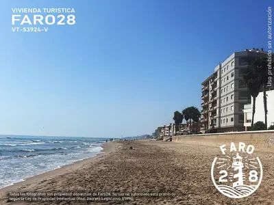 a view of the beach in front of condos at Faro28 in Valencia