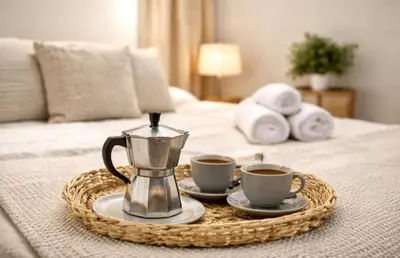 a tray with two cups of coffee on a bed at Avakian Valencia Centro in Valencia