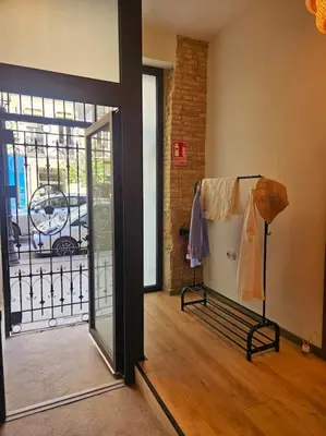 a room with a door open to a balcony at Tradicional Casa con patio Ruzafa in Valencia