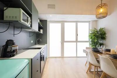 a kitchen and dining room with a table and chairs at 2 rooms 4 Pax, new flat, wifi AC in Valencia