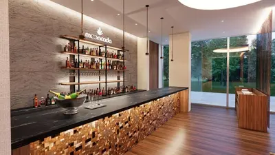 a bar in a restaurant with a wall of bottles at SH Campus Lyceum in Moncada