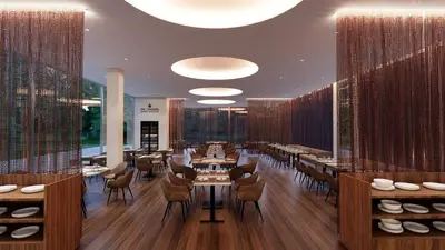 a restaurant with tables and chairs in a room at SH Campus Lyceum in Moncada