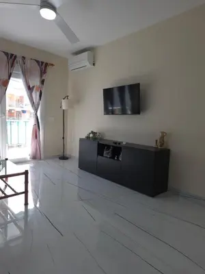 a kitchen with a white refrigerator and a microwave at Sea view apartment in Cullera