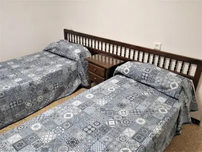 two beds sitting next to each other in a room at Amanecer, 1-2 in Cullera