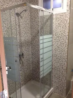 a shower with a glass door in a bathroom at Apartamento para 5 personas en Faro de Cullera in Faro de Cullera