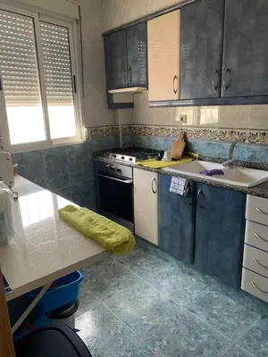 a kitchen with a sink and a stove at Apartamento para 5 personas en Faro de Cullera in Faro de Cullera