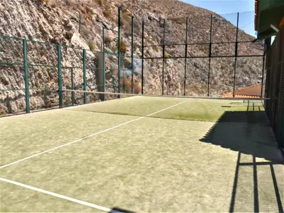 a tennis court with a net on top of it at Bellaterra, BQ-2, BAJO A in Cullera