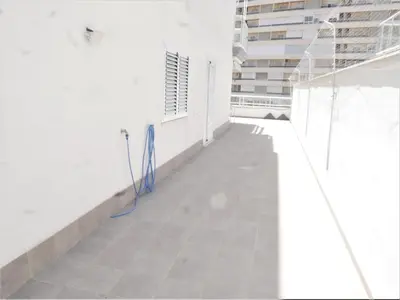 a hallway with a blue cord on the floor of a building at Bellaterra, BQ-2, BAJO A in Cullera
