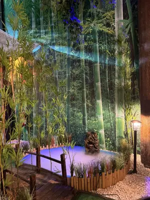a garden with trees in the background at The POD Suite Hostel Village in Valencia
