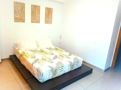 a small bed in a room with at BEACH VALENCIA LUXURY D15-9 Apartment with terrace and sea views with two rooms in Valencia