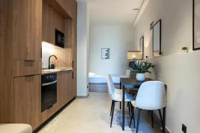 a kitchen and dining room with a table and chairs at VLC HOST - Zapadores in Valencia
