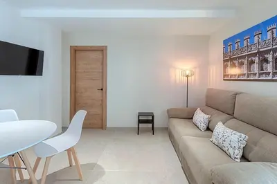 a living room with a couch and a table at Ruzafa´s Gate 3 in Valencia