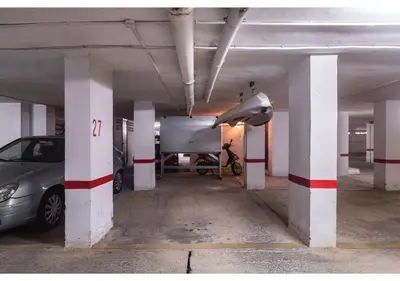 a parking garage with a car parked in it at El balcón del mar - 1ª línea y frontal al mar in Cullera