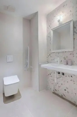 a bathroom with a toilet and a sink and a mirror at Portal de Ruzafa 4 in Valencia