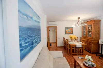 a living room with a couch and a table at Lovely apartment near the beach & City of Arts and Sciences in Valencia