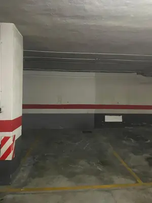 a garage with a red and white wall at Lovely apartment near the beach & City of Arts and Sciences in Valencia