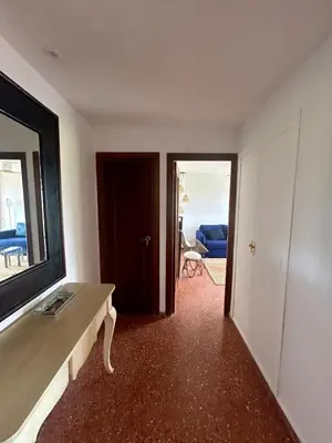a room with a table and a view of a bedroom at District Key - Saler, Av Gola Puchol 14 in Valencia