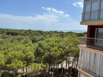 a balcony of a building with a view of trees at District Key - Saler, Av Gola Puchol 14 in Valencia