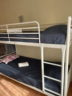 a couple of bunk beds in a room at Sea-Breeze Apartment with Pool & Parking in Cullera