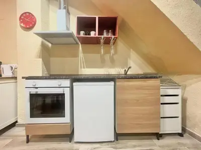 a kitchen with a counter with a sink and a stove at Casa Abanico in Cullera in Cullera