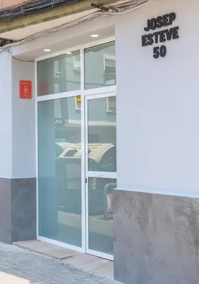 a glass door of a building with a sign on it at Moderno, amplio y muy cómodo in Valencia