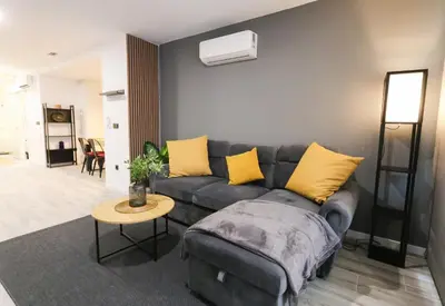 a living room with a couch and a table at Sweet Suites in Valencia
