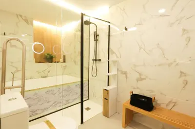 a bathroom with a shower and a toilet and a sink at Sweet Suites in Valencia