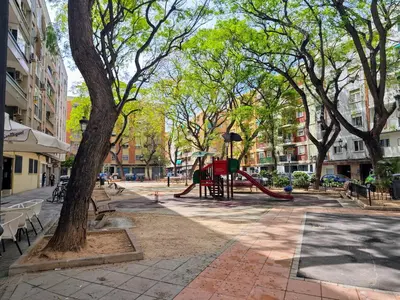 a playground in the middle of a city street at Sweet Suites in Valencia