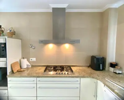 a kitchen with a stove top oven in a kitchen at Cullera Valencia Escapada de ensueño in Valencia