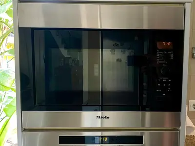 a microwave oven with the word mica on it at Cullera Valencia Escapada de ensueño in Valencia