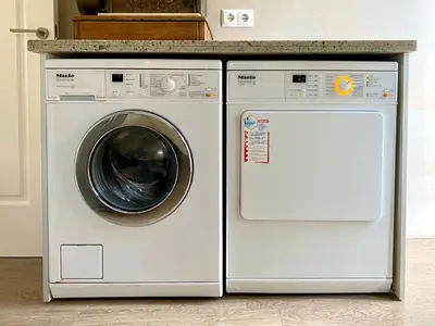 a washing machine and a dryer in a kitchen at Cullera Valencia Escapada de ensueño in Valencia