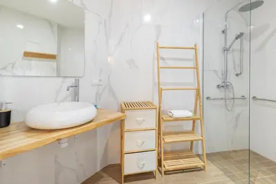 a bathroom with a sink and a shower at Travel Habitat Bioparc Apartments in Valencia