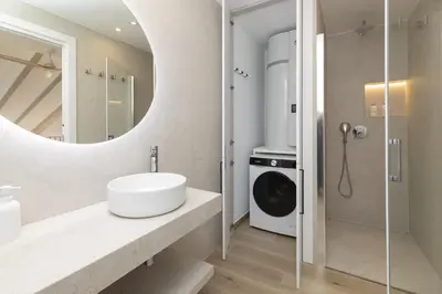 a bathroom with a sink and a mirror at ApartUP Ca La Leni Beach V in Valencia