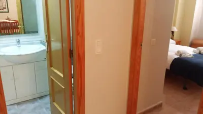 a bathroom with a sink and a mirror at Apartamento playa de Canet WIFI in Canet de Berenguer