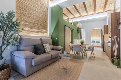 a living room with a couch and a table at GREEN&FRESH Apartament in Valencia