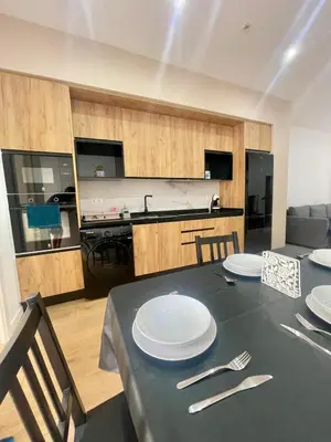a dining room with a table with plates and silverware at UIM Mediterraneo CASA Gomez Ferrer Wifi in Puerto de Sagunto