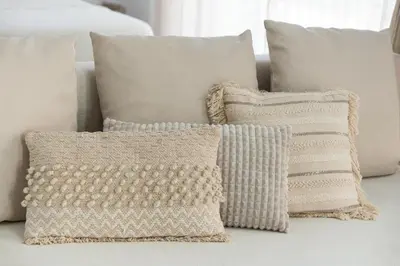 a group of pillows sitting on a couch at SOHO BY THE SEA Valencia in Valencia