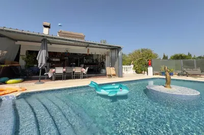 a swimming pool with a toy whale in the water at El Refujio maison independante avec vraie piscine privée au sel chauffee pas de chlore in Turís