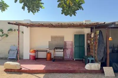 a patio area with a table and a table at El Refujio maison independante avec vraie piscine privée au sel chauffee pas de chlore in Turís