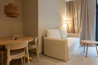 a room with a bed and a table and a table and chair at VLC HOST - Molina del Palau in Valencia