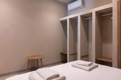 a room with a bed with two towels on it at VLC HOST - Molina del Palau in Valencia