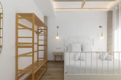 a room with a ladder and white walls at ApartUP Ca La Leni Beach IV in Valencia