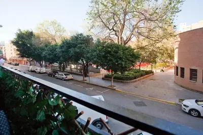 a view of a city street with cars parked on the road at 4-Bed Sleeps 7 Free Parking in Valencia