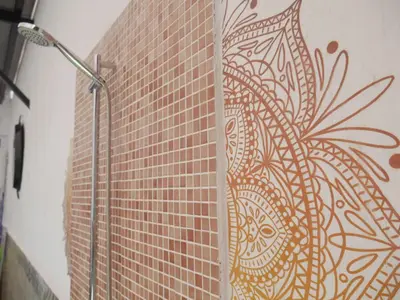a brick wall with a shower in a bathroom at Casa Vistalmar in Cullera