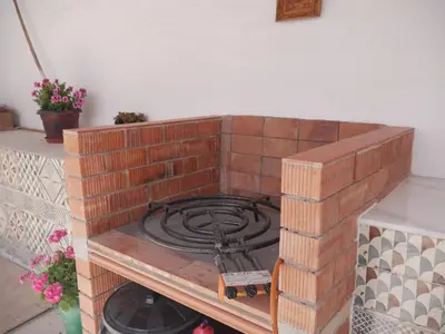 a brick stove in a brick oven in a room at Casa Vistalmar in Cullera