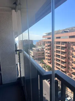 a view of a city from a building window at APARTAMENTO Playa Patacona VALENCIA in Valencia