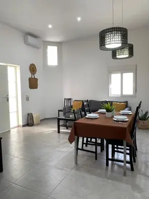 a living room with a table and a couch at uim mediterraneio PB vicente andres estelles wifi in Puerto de Sagunto
