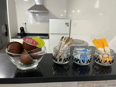 a counter with three glass jars and a bowl of eggs at Apartamentos ESPIGAS PUERTO in Valencia