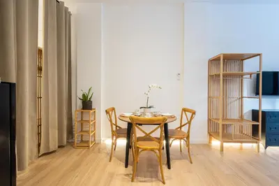 a dining room with a table and chairs at The Blasco Ibañez Apartments in Valencia