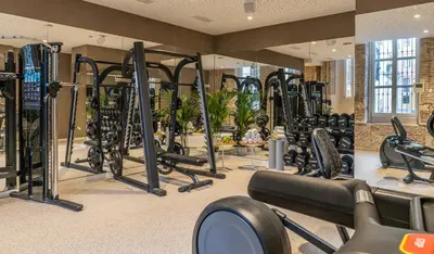 a gym with a lot of treadmills and ellipticals at Axel Hotel Valencia - Adults Only in Valencia